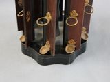 a clock that is sitting on a stand on a table