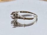a close up of a silver ring on a table
