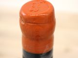 a close up of a bottle of wine on a table