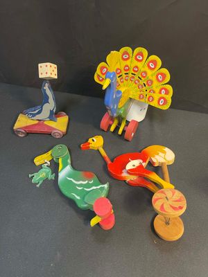 a lot of wooden toys that are sitting on a table