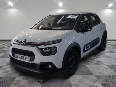 the white citrole is parked on a checkered floor