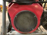 a close up view of the front end of a red tractor
