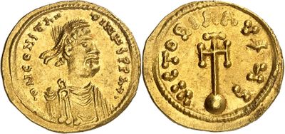 a gold coin with an image of a man on it