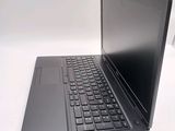 a laptop that is sitting on a white table