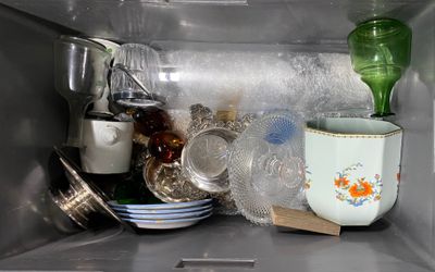 many dishes and cups inside of a microwave