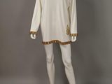 an image of a mannequin wearing a white dress with gold trims