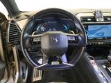 the interior of a car with a steering wheel and dashboard controls