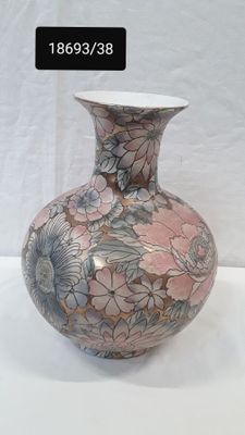a vase that is sitting on a white table