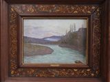une image représentant un tableau représentant une rivière, dans un cadre en bois