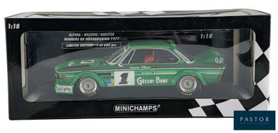 the box is black and white with a green car in it