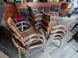 several chairs are lined up in front of a bar in a restaurant