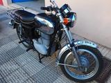 a motorcycle that is parked on the side of the street