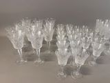 a lot of wine glasses that are sitting on a table