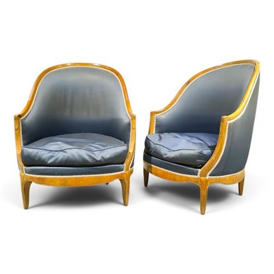 pair of blue upholstered armchairs with wood frame and upholstered seat