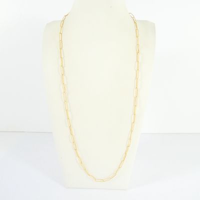 a white mannequin torso with a gold chain necklace on it