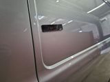 a close up of a car door handle with a sticker on it