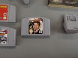 four nintendo game cartridges sitting on a table next to each other