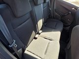 the back seats of a car with a view of a highway
