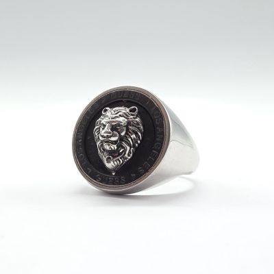 the lion head ring is made from silver and black enamel