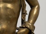 a bronze statue of a man with a rope around his neck