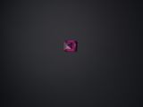 a pink diamond on a black background