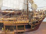 a model of a ship on display in a glass case