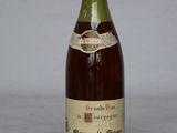 a bottle of wine that is sitting on a table