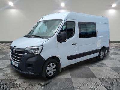 the white van is parked on a checkered floor in a room