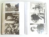 an open book with a picture of a man on a motorcycle
