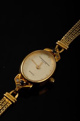 Montre de dame en plaqué or jaune le cadran oval Christian B…