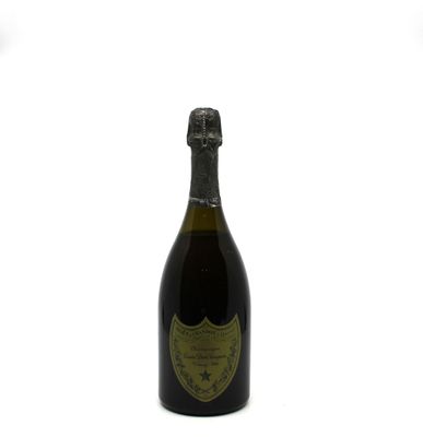 an image of a bottle of champagne sitting on top of a table
