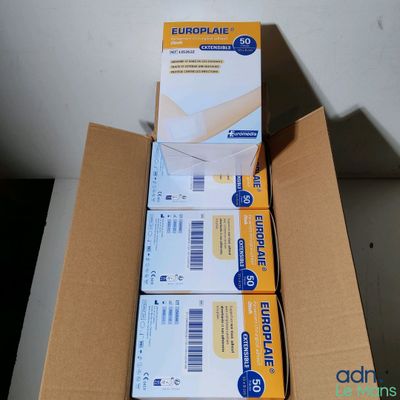 three boxes of mail sitting on top of a table next to each other