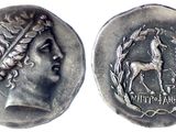 a close up of a coin with an image of a woman on it