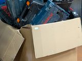 a box full of tools sitting on a pallet in a warehouse