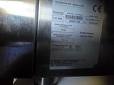 a close up of a microwave oven with a label on it