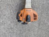 an image of a chainsaw laying on the ground