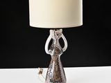 a lamp that is sitting on a table with a lamp on it