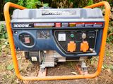 a portable generator sitting on the ground in the yard