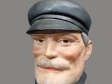 un buste d'homme coiffé d'un chapeau