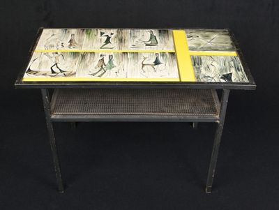 a glass table with pictures on it on a black background