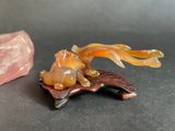 a small piece of rock next to a small piece of stone