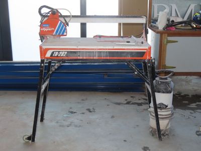 a table with a saw on it in a room