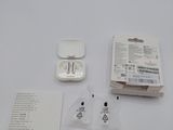 a white box with an electronic device in it on a table