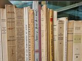 a lot of books that are sitting on a shelf