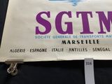 a sign that says sgim on it on a table