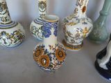 five vases that are sitting on a table