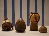 three different types of vases on display on a table