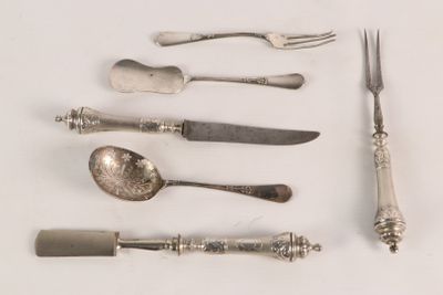 a lot of silver spoons and forks on the table