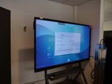 a flat screen tv sitting on a stand in a room