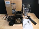 a blender that is sitting on a table next to a box